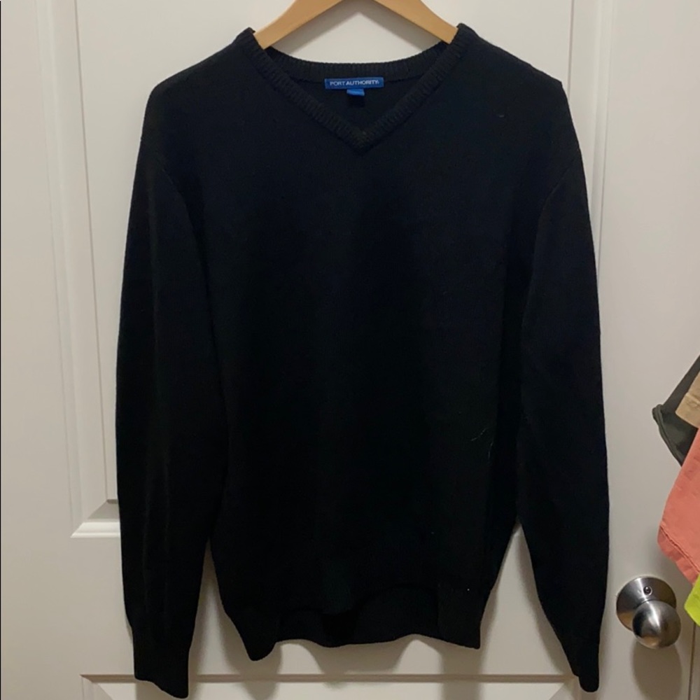 A black knitted pullover sweater
